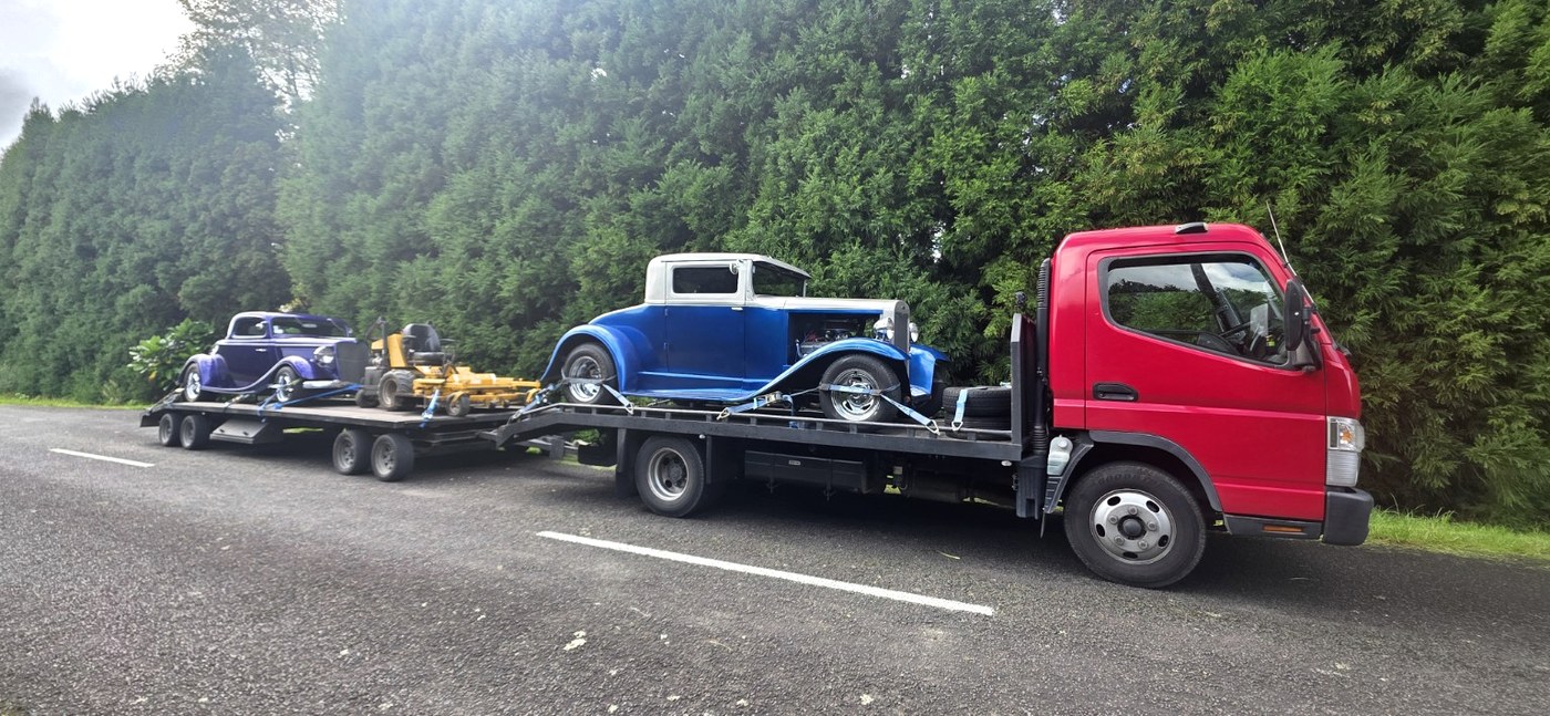 Tow Bro Transport carrying classic cars